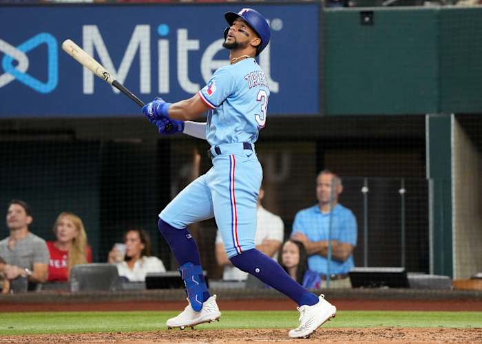 Aug 28, 2022; Arlington, Texas, USA; Texas Rangers center fielder Leody Taveras (3) follows through for a double against the Detroit Tigers during the fifth inning at Globe Life Field. Mandatory Credit: Jim Cowsert-USA TODAY Sports
